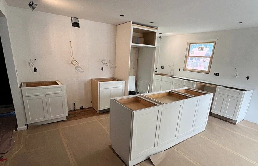 Cabinet installation in Hicksville kitchen by Kuhn Construction