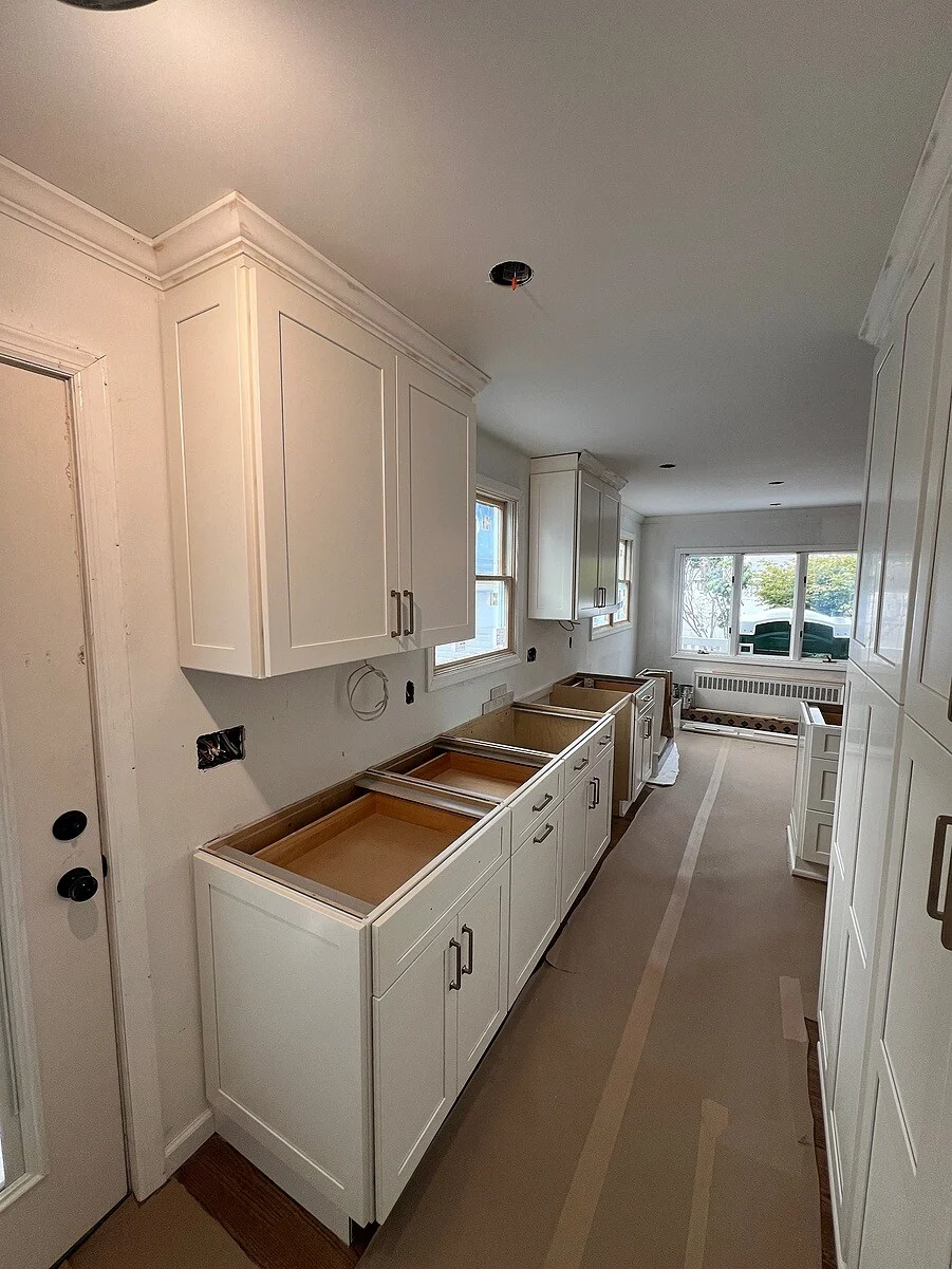 Cabinet installation in Hicksville kitchen by Kuhn Construction