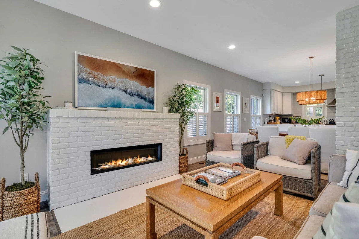 Living room remodel with painted brick fireplace and recessed lighting by Kuhn Construction-1