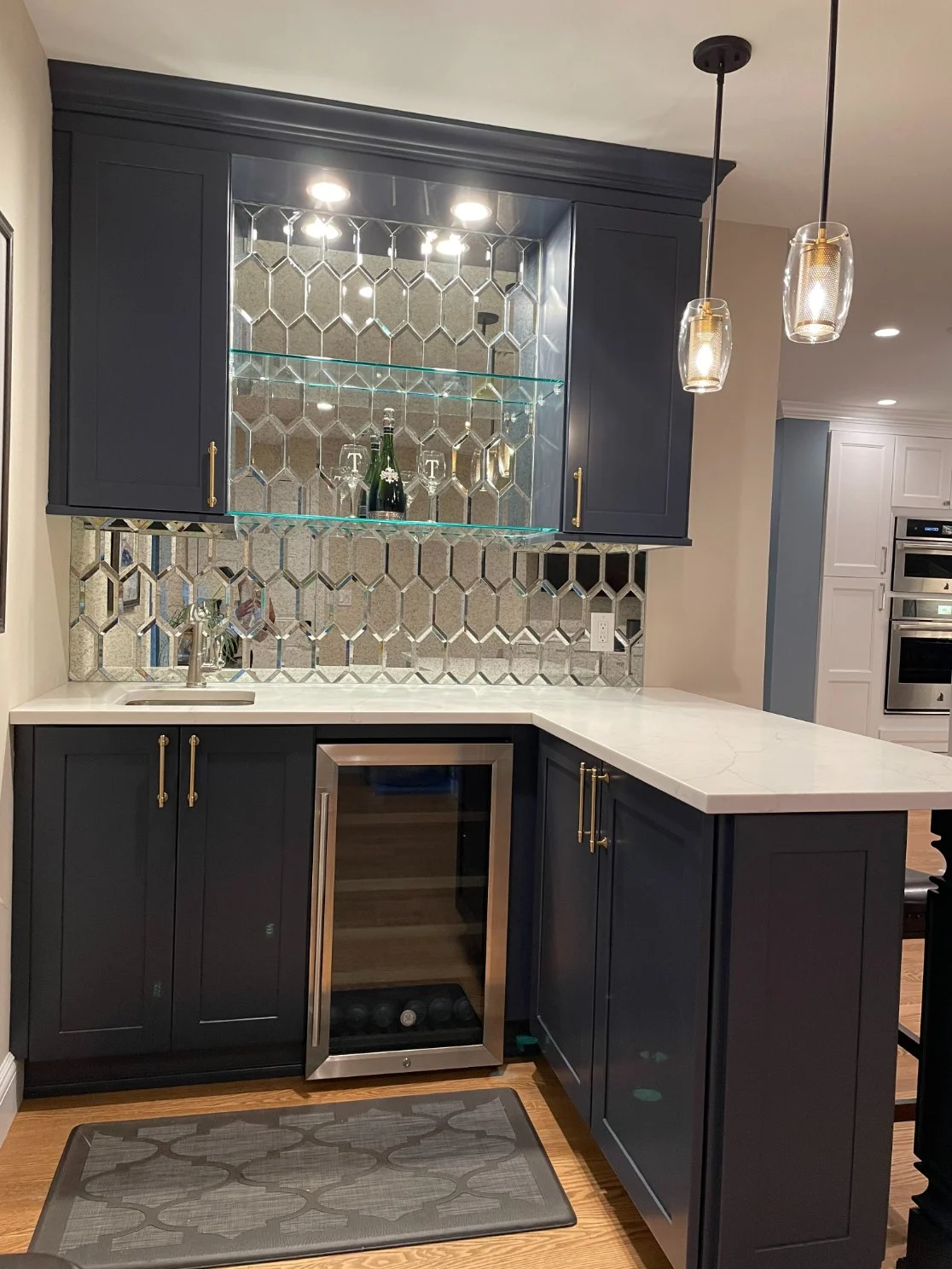 Mini bar with glass mosaic backsplash in Islip, New York kitchen remodel by Kuhn Construction